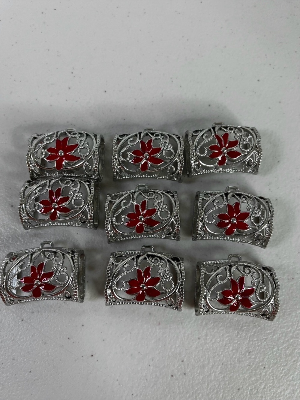 Lot of 9 metallic scarf slides/bails with red poinsettia - scarf jewelry